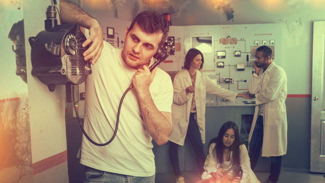 A company employee talking on the phone using an old handset/traditional telephone system.