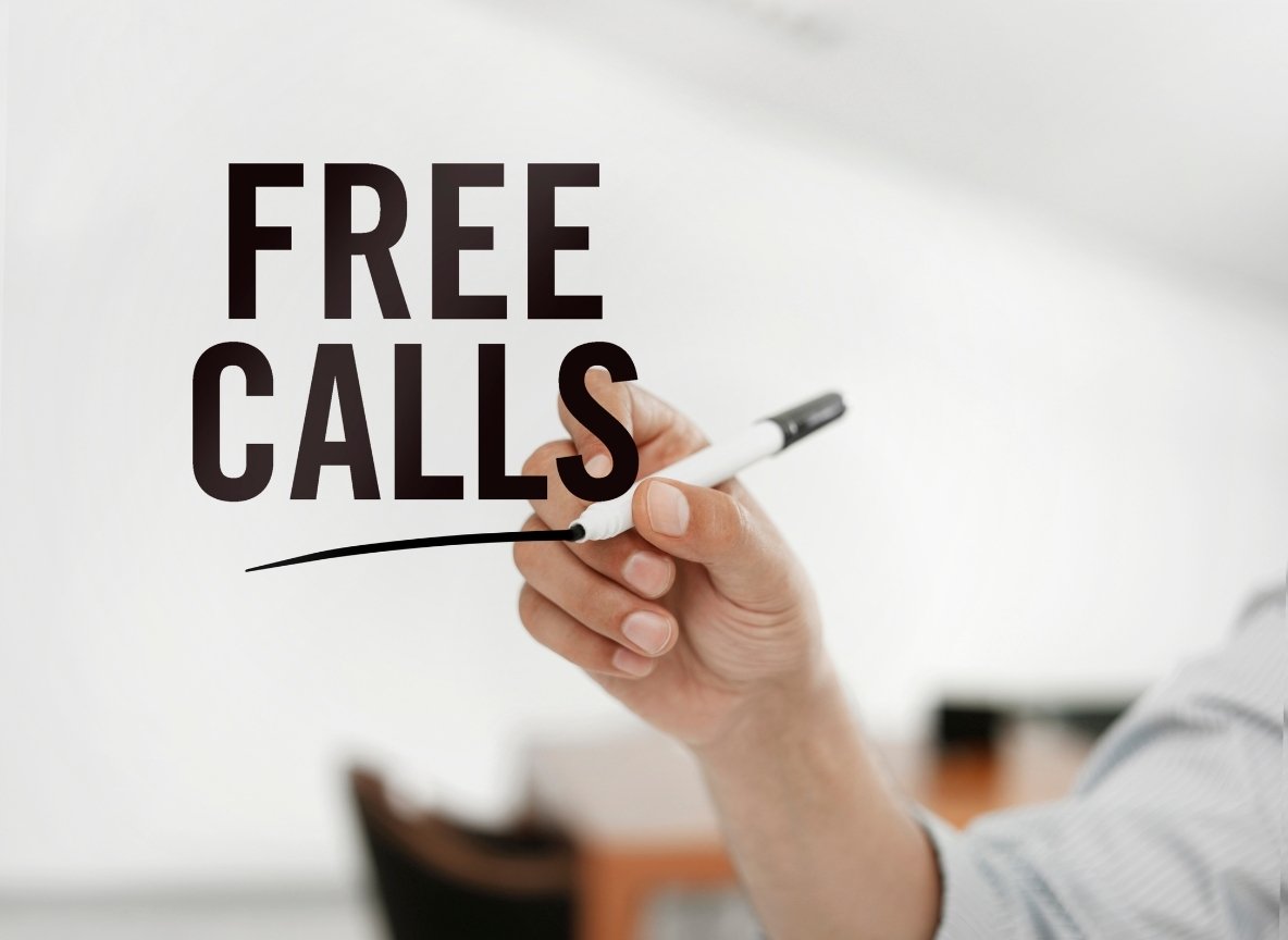 Hand writing "free calls" to illustrate toll-free 0800 numbers for Germany, Austria, and Switzerland